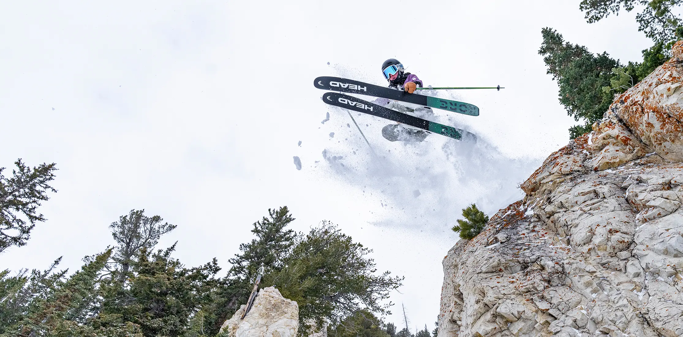 Hero of girl jumping off a Cliff at Snowbird