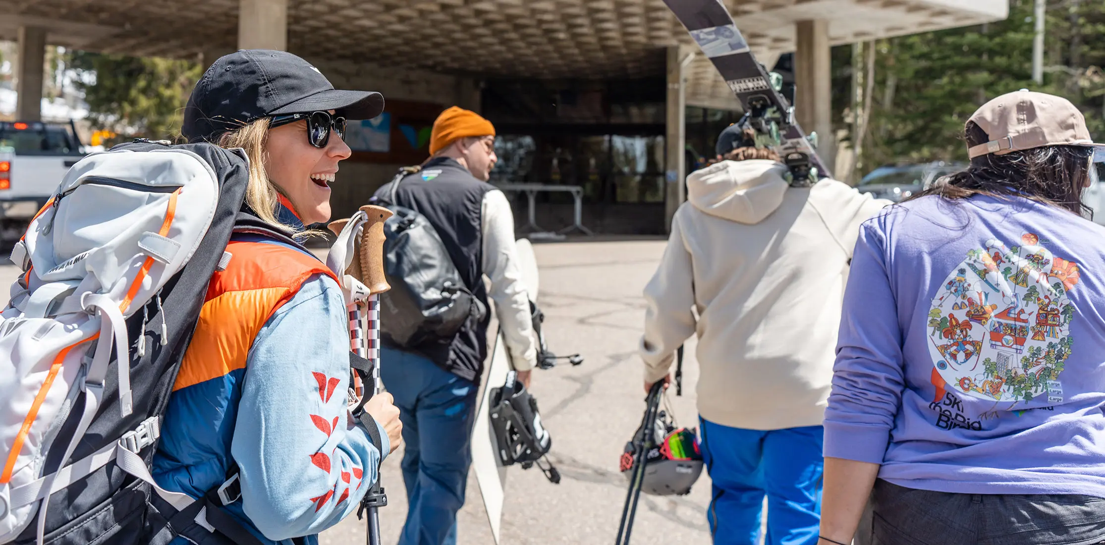 Group walks toward the Snowbird Center in wings apparel