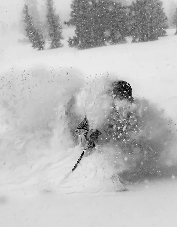 Mobile hero of skier in deep powder, black and white for black friday