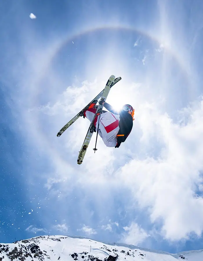 Mobile hero of a skier doing a grab off the Snowbird wave