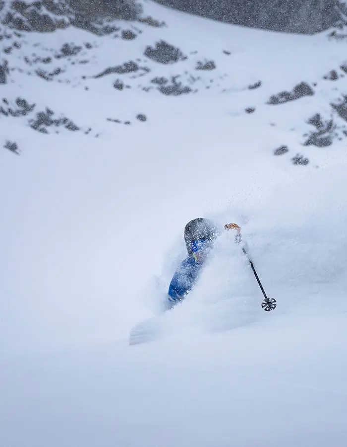 Mobile hero of skier in april storm snow