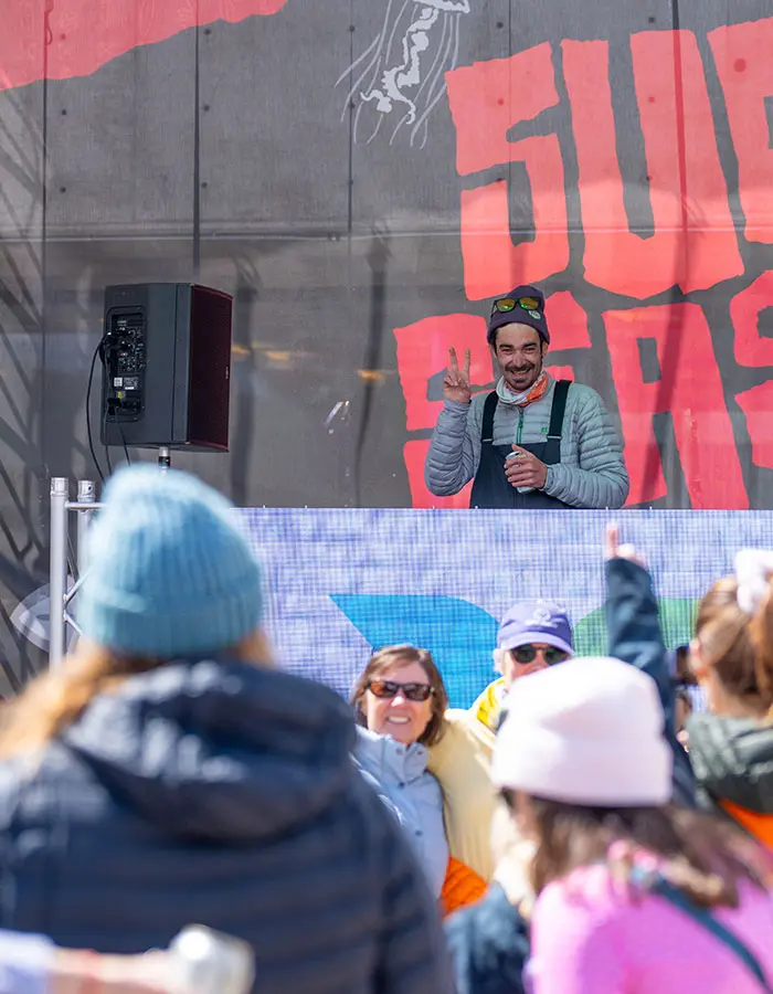 Mobile hero- DJ poses and smiles during electronic music weekend at Plazapalooza