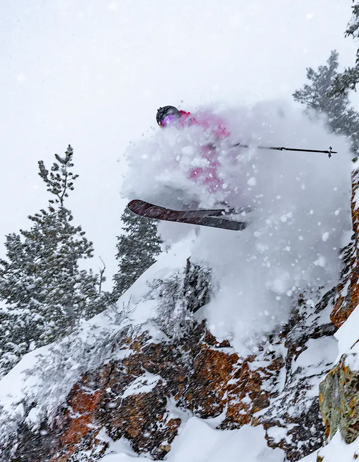 Skier jumps off a cliff- promotion for Season Pass price increase