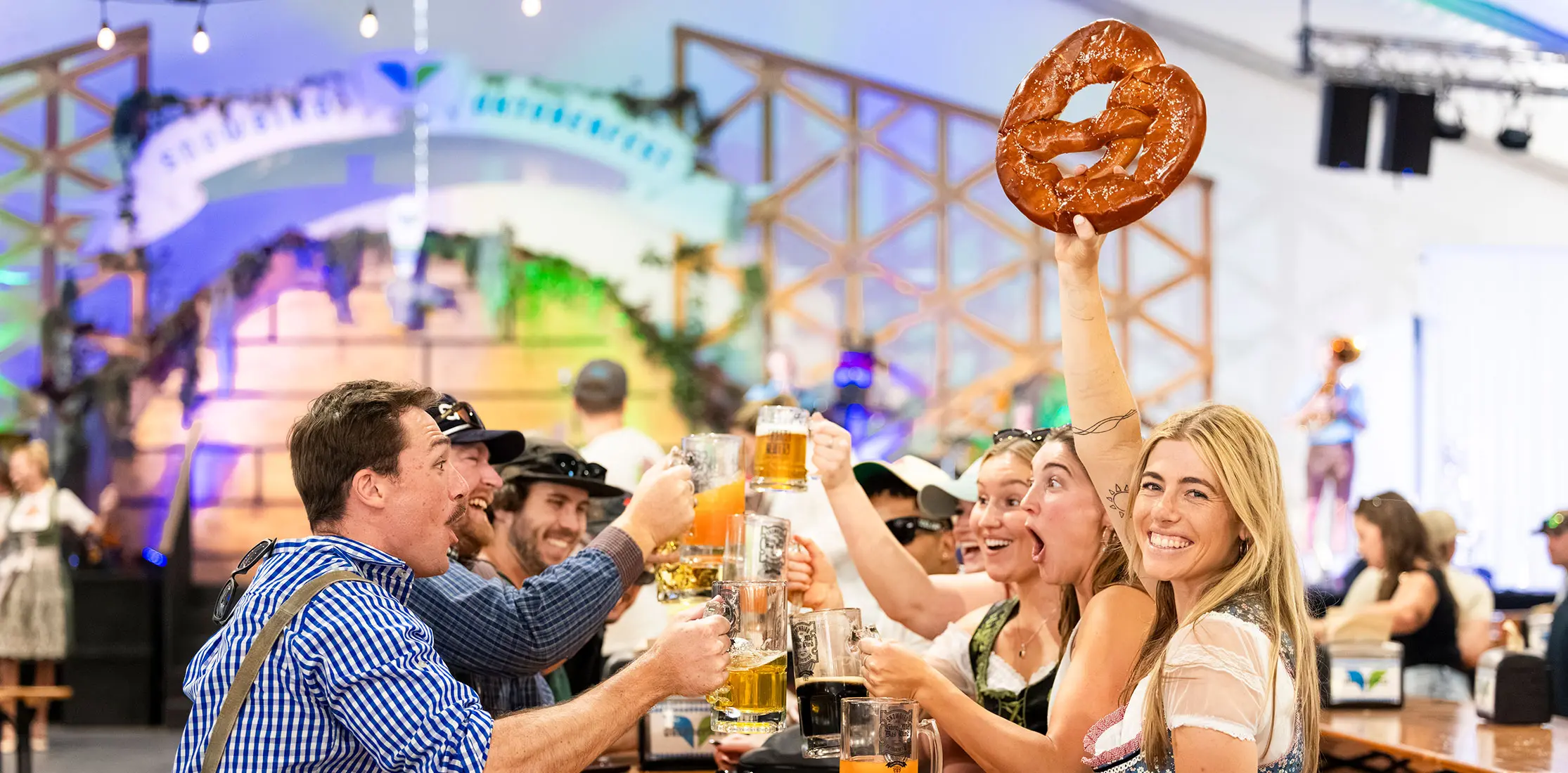 Group enjoys beers at Oktoberfest at Snowbird with a uber pretzel