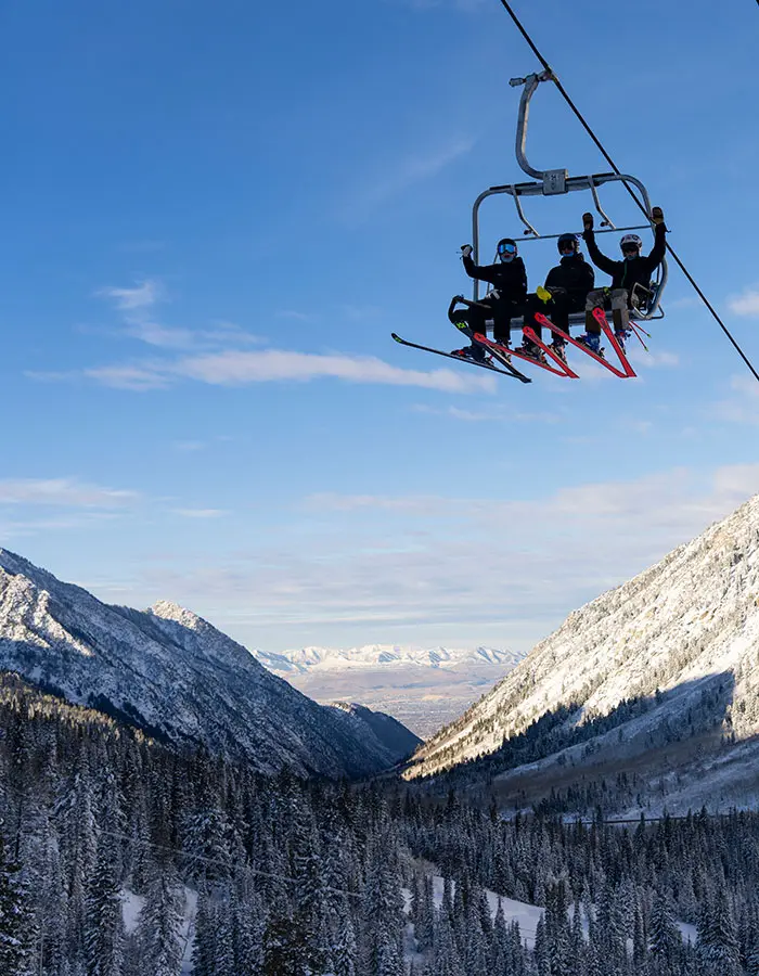 Mobile hero of a group cheering on the lift at Snowbird's opening day