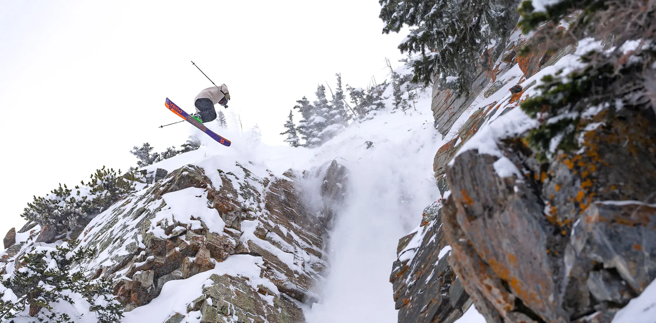 Freeride World Tour athlete - ross tessler - hits a cliff at Snowbird's Broom closet