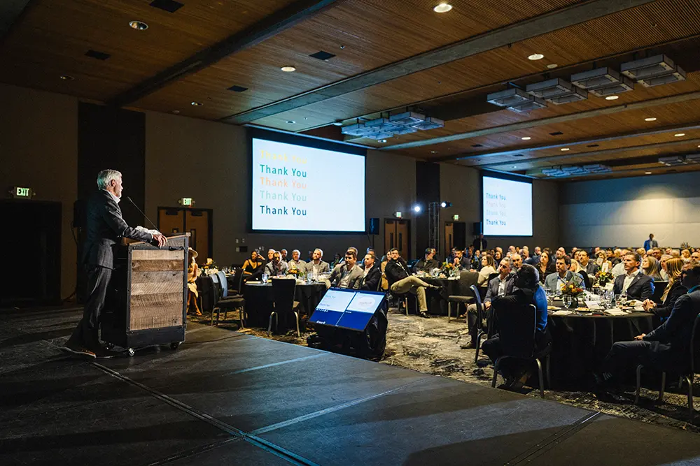 Speaker on stage during a corporate event at Snowbird